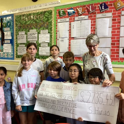 Handing over the cheque to 'The Friends Of Stamford Park'.